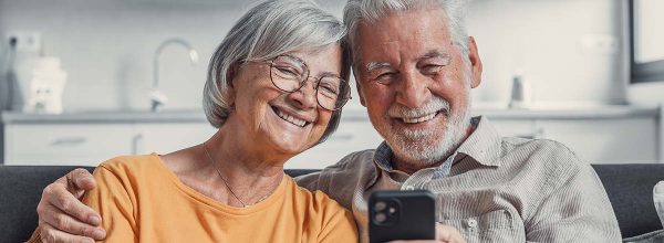 Senior couple enjoying a selfie together at home.